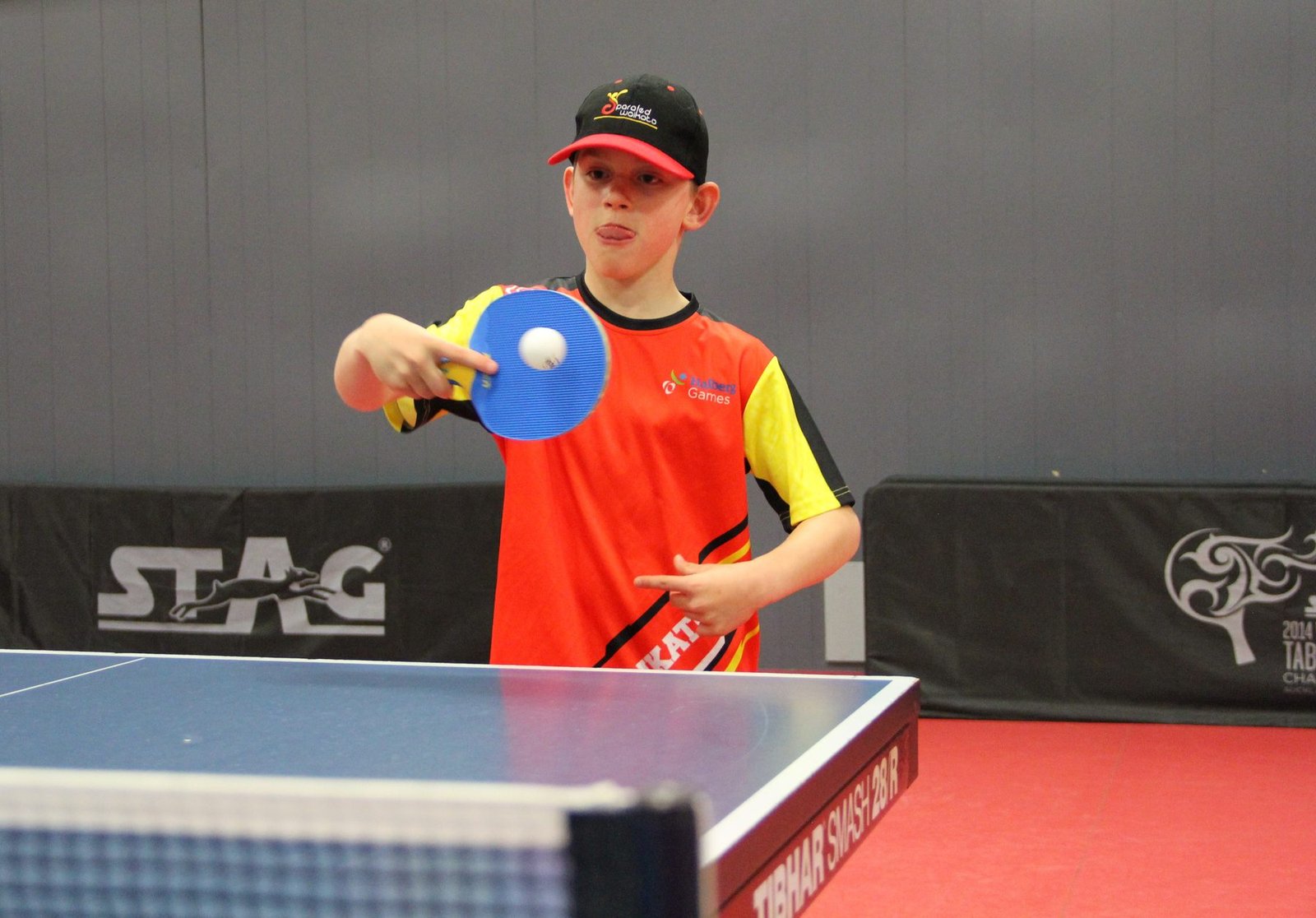 Zac Schultz serving during a table tennis match for Parafed Waikato
